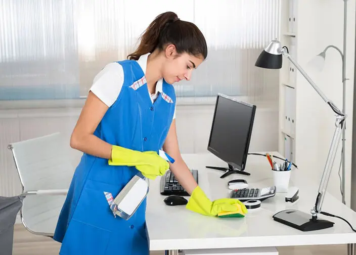 Lady cleaning table