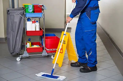 Man cleaning floor using wiper